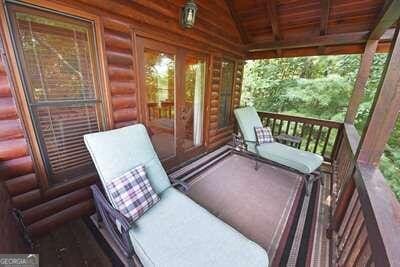 sunroom featuring wooden ceiling, lofted ceiling, and a healthy amount of sunlight