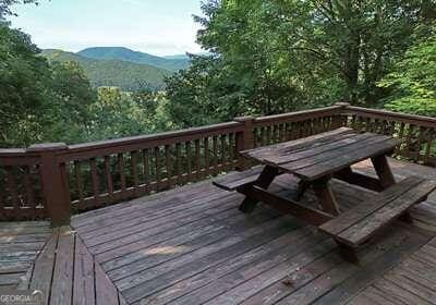 wooden terrace featuring a mountain view