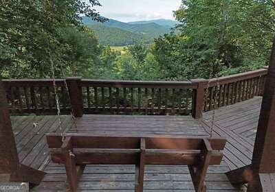 wooden deck with a mountain view