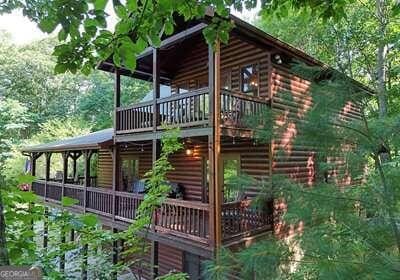 view of home's exterior featuring a wooden deck