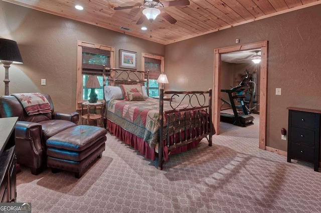 carpeted bedroom with ceiling fan and wooden ceiling