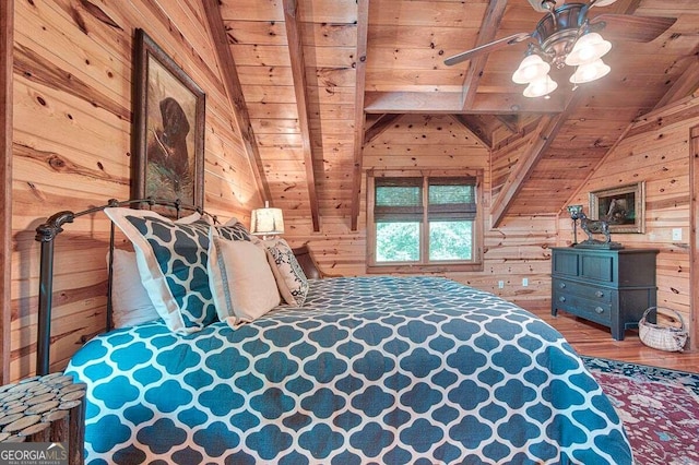 bedroom with ceiling fan, lofted ceiling with beams, wood walls, wood-type flooring, and wood ceiling