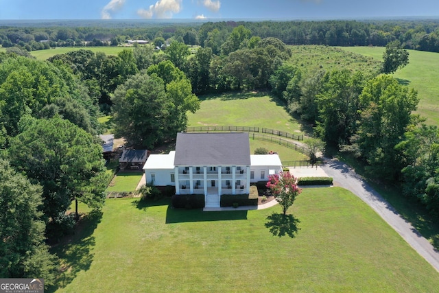 birds eye view of property with a rural view