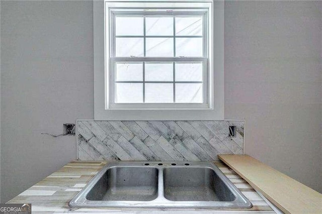 interior details with sink and backsplash