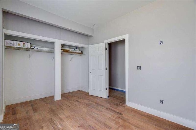 unfurnished bedroom featuring wood-type flooring