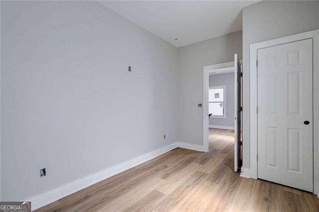 unfurnished bedroom featuring light wood-type flooring