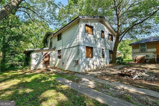 view of property exterior with a yard