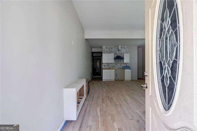 foyer with light hardwood / wood-style floors