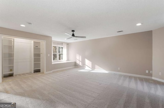 unfurnished room featuring baseboards, a ceiling fan, a textured ceiling, carpet floors, and recessed lighting