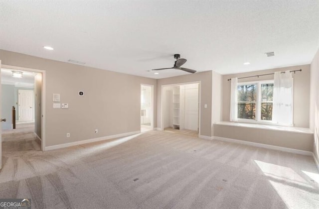 unfurnished bedroom featuring carpet floors, visible vents, and baseboards