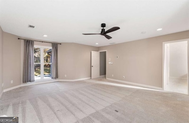 carpeted spare room featuring recessed lighting, visible vents, ceiling fan, and baseboards