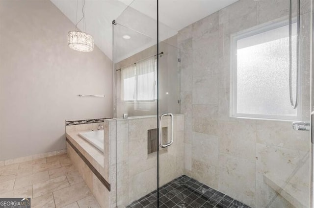 full bathroom with lofted ceiling, a stall shower, a bath, and baseboards