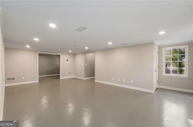 spare room featuring recessed lighting, visible vents, concrete floors, and baseboards