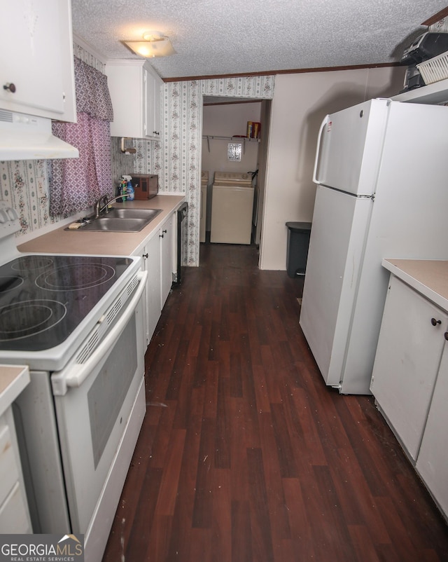 kitchen with white cabinets, a sink, white appliances, a textured ceiling, and under cabinet range hood