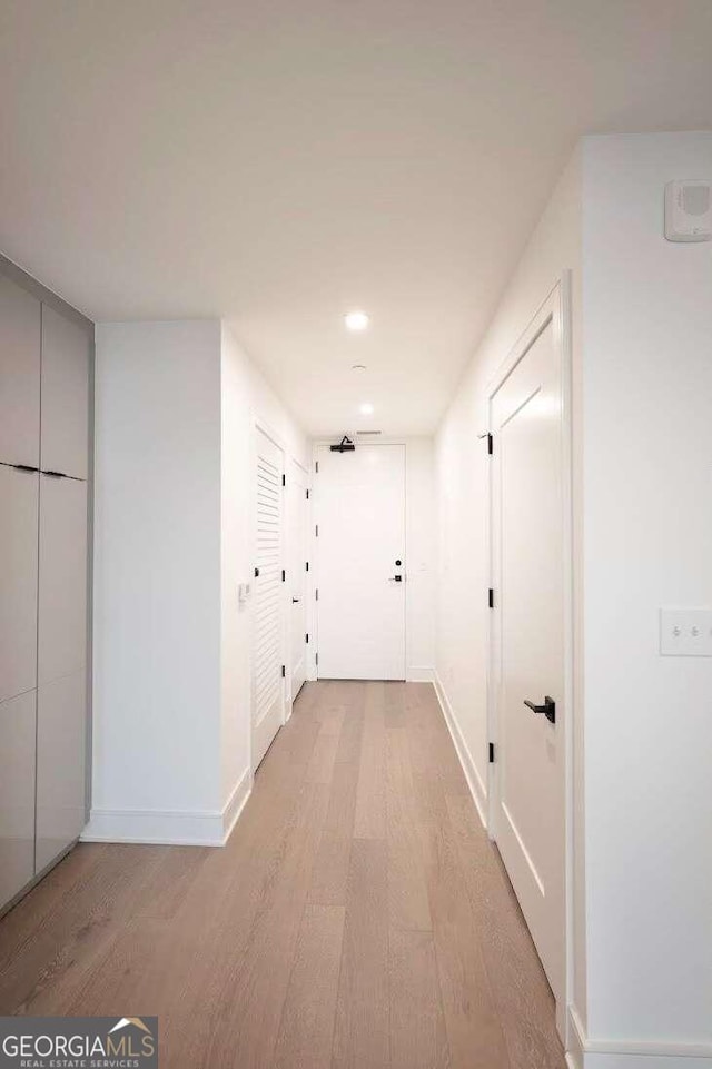 corridor featuring light hardwood / wood-style floors