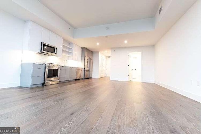 interior space with sink and light hardwood / wood-style floors