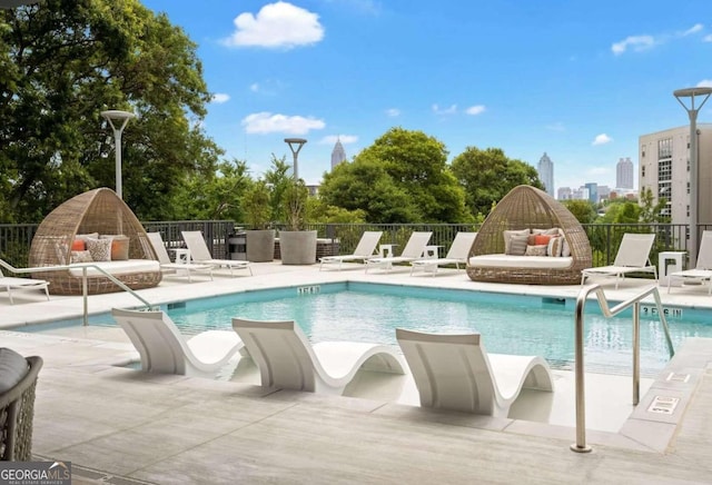 view of swimming pool featuring a patio area