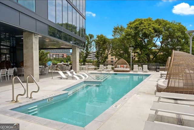 view of pool featuring a patio