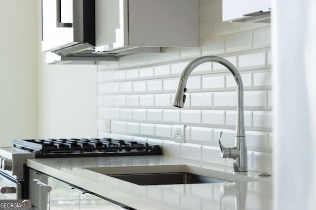 room details with decorative backsplash and sink