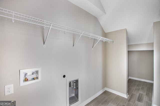 laundry area with washer hookup and hookup for an electric dryer