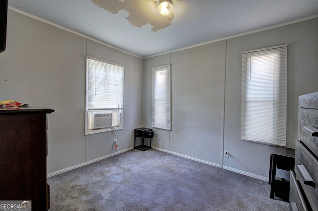 carpeted bedroom with cooling unit and crown molding