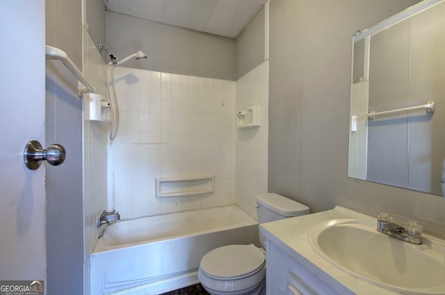 full bathroom featuring vanity, washtub / shower combination, and toilet