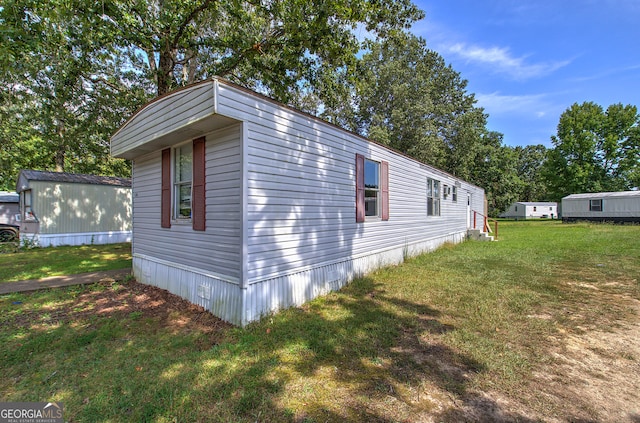 view of property exterior with a lawn