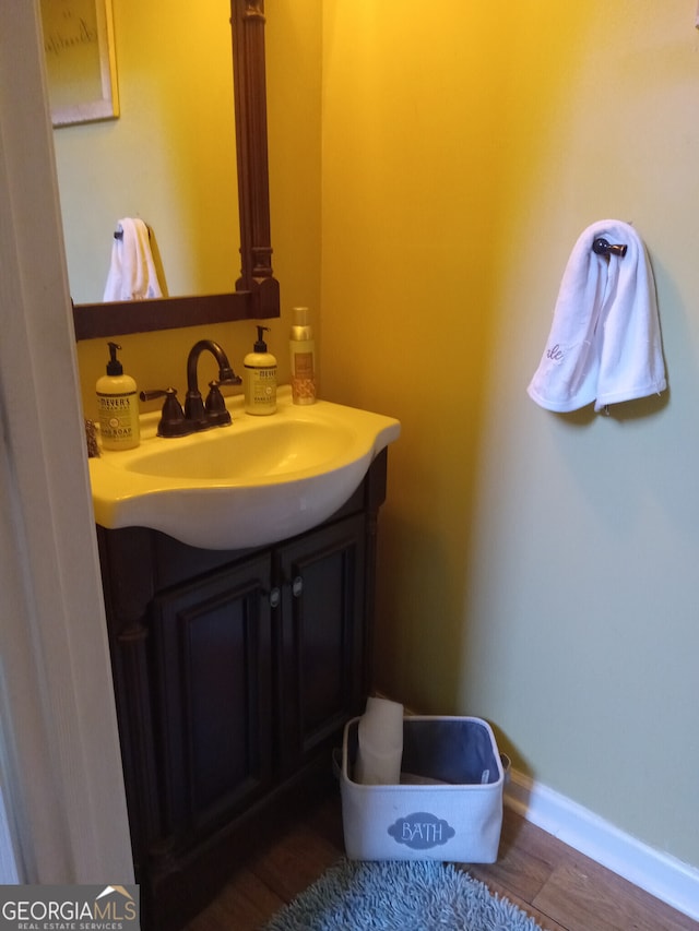 bathroom with vanity and baseboards