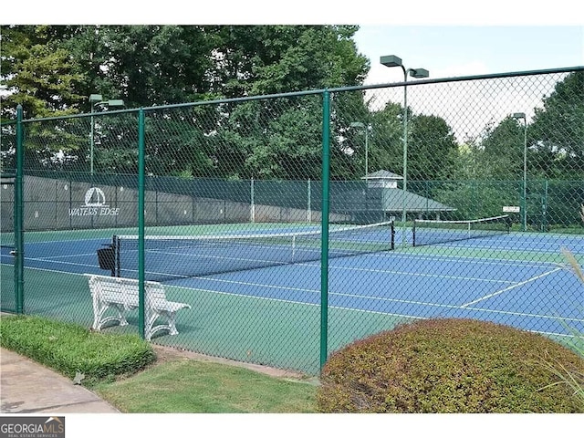 view of sport court with fence