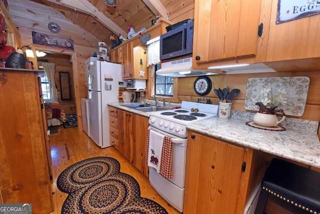 kitchen featuring lofted ceiling with beams, wooden ceiling, wooden walls, light wood-type flooring, and white appliances