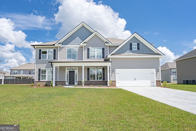 craftsman-style home featuring a garage and a front lawn