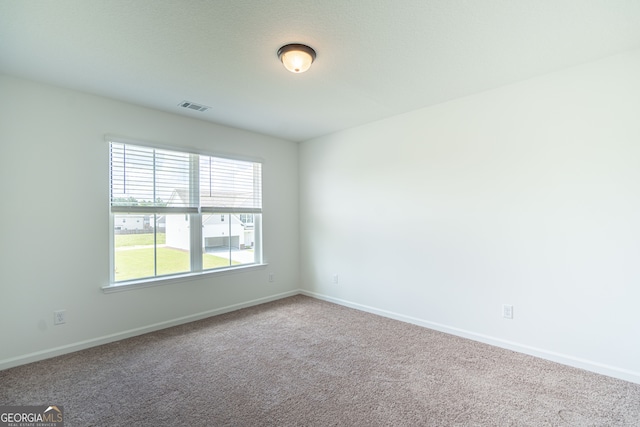 unfurnished room with carpet flooring