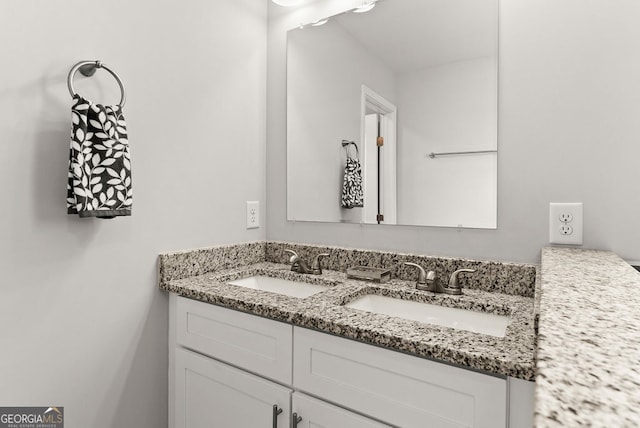 bathroom featuring dual vanity