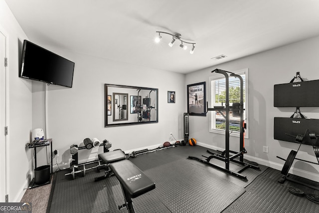 workout room with rail lighting