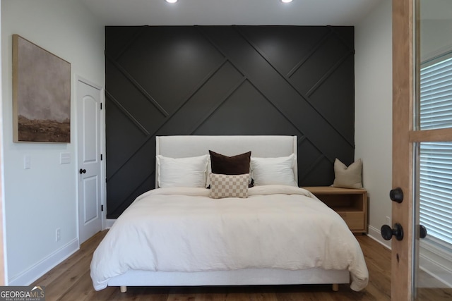 bedroom featuring hardwood / wood-style floors