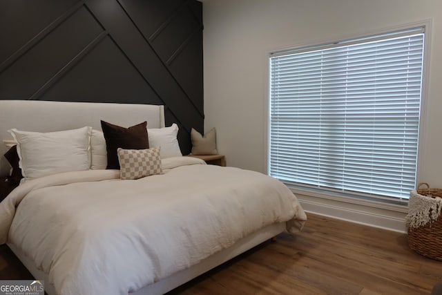 bedroom with hardwood / wood-style floors