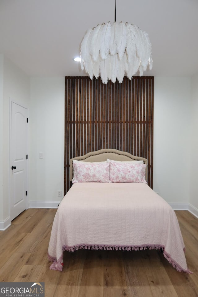 bedroom featuring hardwood / wood-style floors