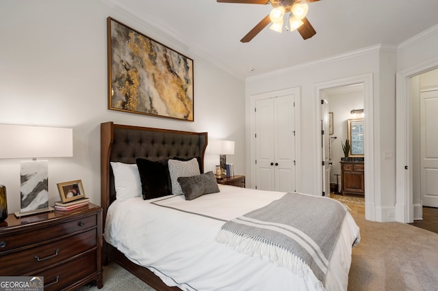 carpeted bedroom with ceiling fan, crown molding, connected bathroom, and a closet