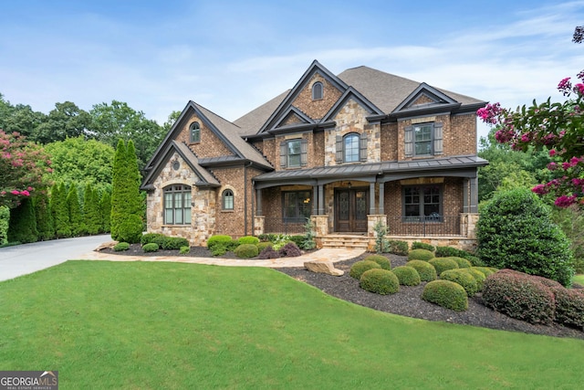 craftsman-style home with a porch and a front yard