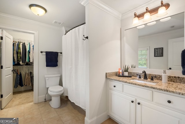 bathroom featuring toilet, ornamental molding, tile patterned flooring, and vanity