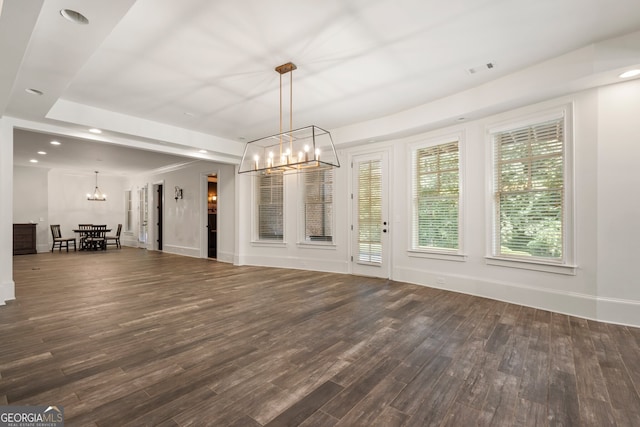 interior space with hardwood / wood-style flooring and an inviting chandelier