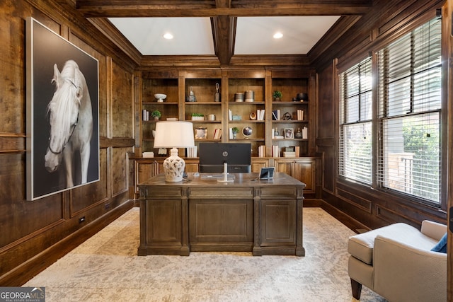 carpeted home office with beam ceiling, built in features, wooden walls, and coffered ceiling