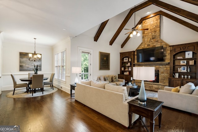 living room featuring beam ceiling, ceiling fan with notable chandelier, dark hardwood / wood-style floors, and a stone fireplace