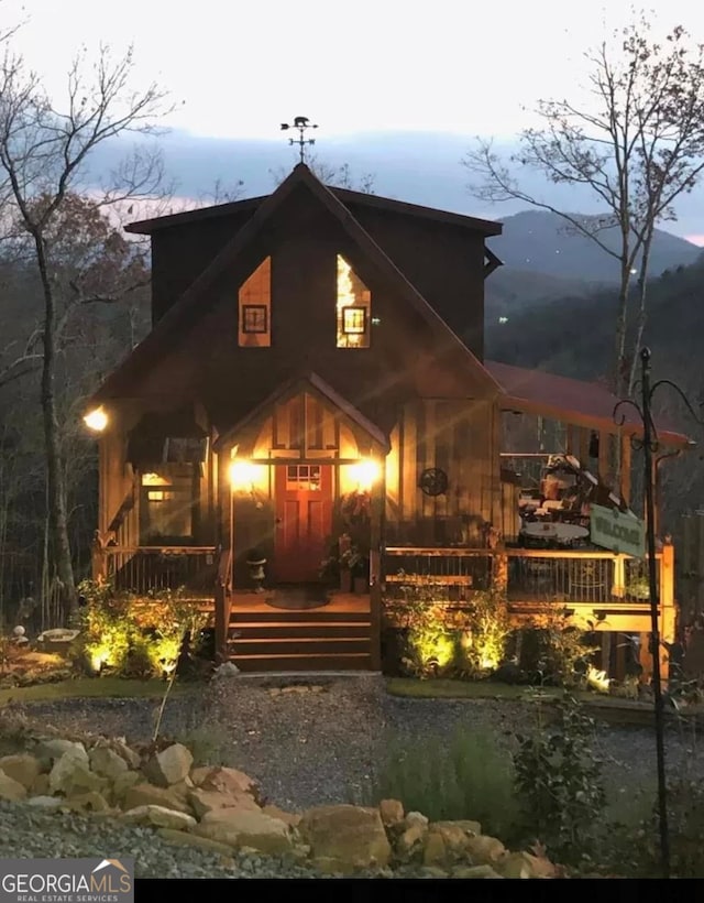 view of front facade with a wooden deck