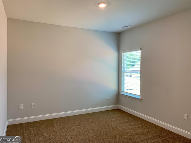 spare room featuring carpet