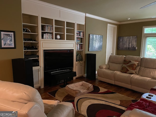 living room with crown molding, dark hardwood / wood-style floors, and built in features