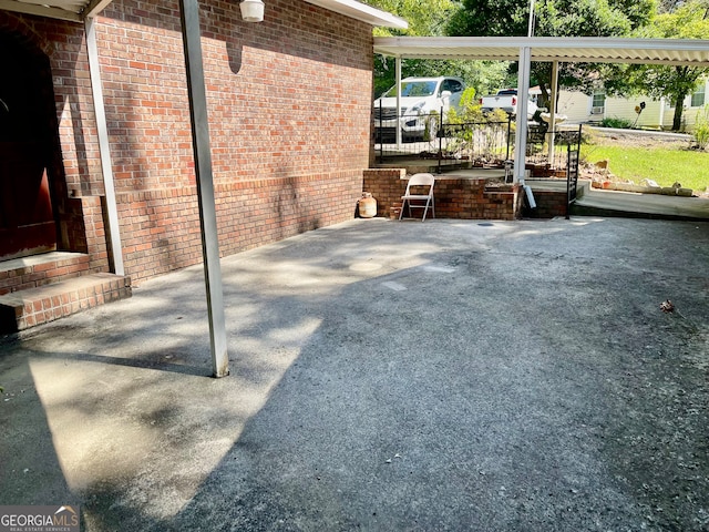 view of patio / terrace with a carport