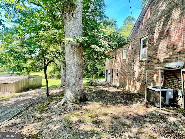 view of yard featuring central air condition unit