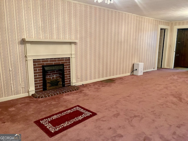 unfurnished living room with a fireplace, carpet flooring, and crown molding