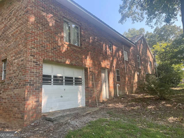 view of property exterior featuring a garage